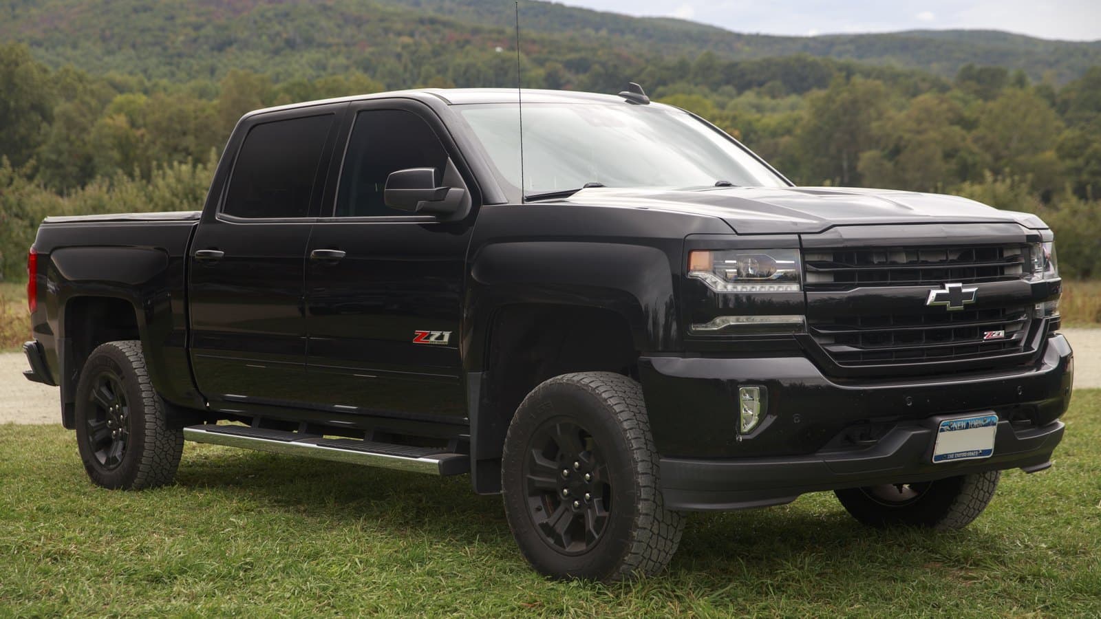 Black 2016 Chevrolet Silverado 1500 LTZ Z71 Crew Cab pickup parked on grass